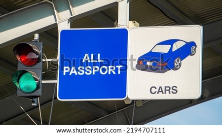 European border crossing sign with green traffic light. Customs checkpoint for cars. Passport verification and document inspection at border crossing.