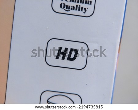 Close-up of an "HD" text on a white box