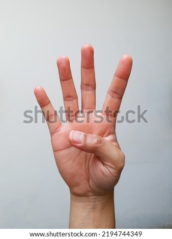 photo isolated hand gesture number four with four finger up
