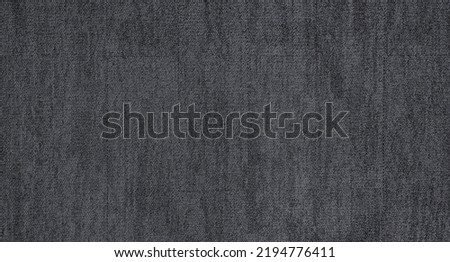close up of monochrome grey carpet texture background from above. texture tight weave carpet. the dark color background of the carpet. Royalty-Free Stock Photo #2194776411