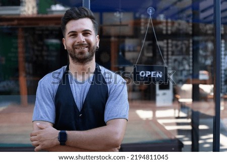 small business owner opening at the door 