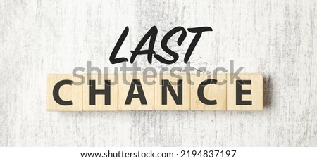 Time to last chance symbol. Concept words Last chance on wooden blocks