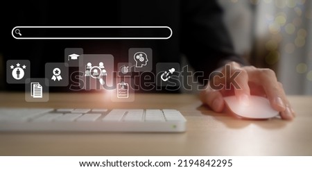 Recruitment and HRM concept.  Job search, headhunting and recruitment process.  Working on computer and searching the infomation of education, qualification, cv, resume, skills and experience. Royalty-Free Stock Photo #2194842295