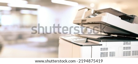 Photocopier printer, Close up the copier or photocopy machine office equipment workplace for scanner or scanning document and printing or copy paper duplicate and Xerox. Royalty-Free Stock Photo #2194875419