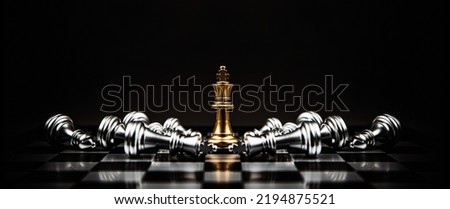 King chess pieces stand on falling chess concepts of competition challenge of leader business team or teamwork volunteer or wining and leadership strategic plan and risk management or team player. Royalty-Free Stock Photo #2194875521