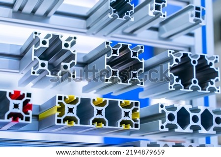 Cross sections of extruded aluminium or aluminum channels for use in manufacturing and fabrication Royalty-Free Stock Photo #2194879659