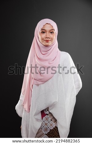 Cute Asian women wearing pink hijab with isolated background.