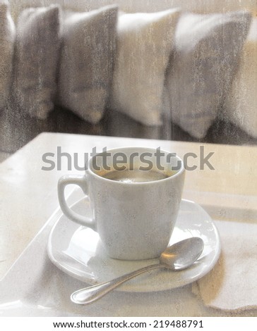 a photo of coffee in white mug on table with texture