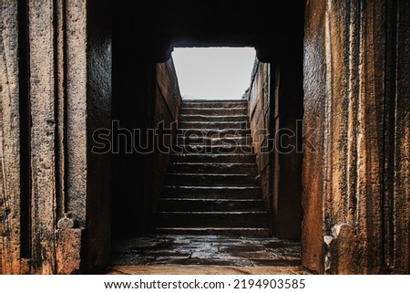 Badami cave entrance door with rock stairways,India