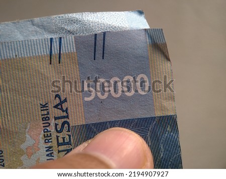 Close up of a number "50000" on an Indonesian banknote