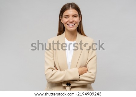 Portrait of self-confident successful business coach with crossed arms isolated on gray studio background Royalty-Free Stock Photo #2194909243