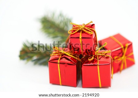 Christmas presents, ornaments on white background, . Icons of the festive season. Shallow depth of field to give a depth to the picture.