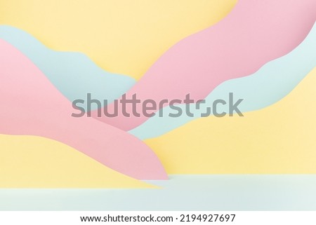 Abstract scene - landscape with mountains of paper in soft light pastel pink, yellow, mint color in funny cute children style. Creative background for design, presentation, poster, flyer, card, text.