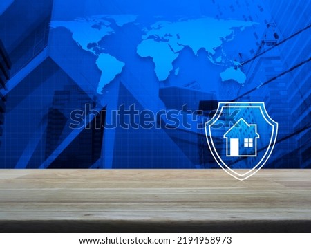 House with shield flat icon on wooden table over world map, modern city tower and skyscraper, Business home insurance and security concept, Elements of this image furnished by NASA