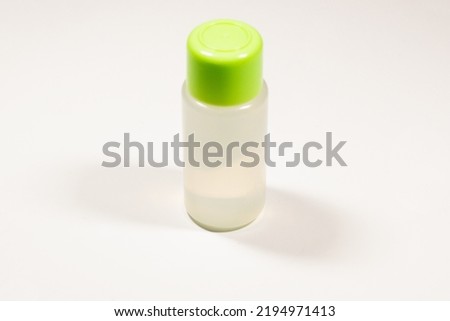 Medical plastic bottle. White plastic medicine bottle with a cap on a white background. Layout. High resolution photo.