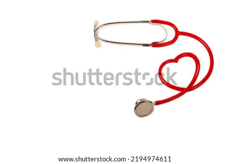 Red heart Stethoscope isolated on white with copy space. Doctor object, equipment supplies, heart shape, close up. Medical and cardiology concept. Studio shot. Banner space mock up for adding text. 