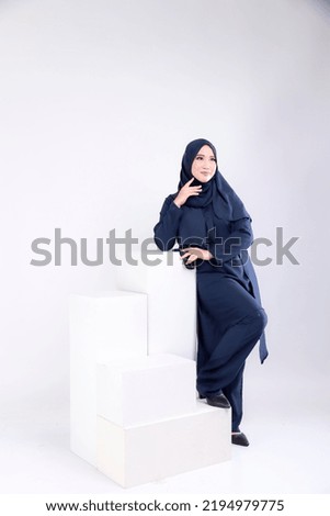 Cute Asian women wearing hijab with isolated background.