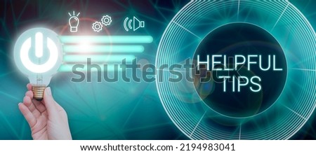 Writing displaying text Helpful Tips. Business showcase Useful secret Information Advice given to accomplish something Woman With Light Bulb And Digital Power Button Sharing New Ideas. Royalty-Free Stock Photo #2194983041