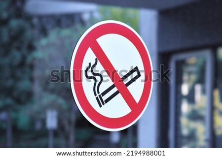Red round 'No smoking' sign with crossed out cigarette icon