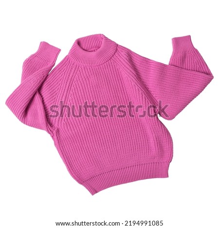Pink knitted wool sweater, as if dancing with arms raised, on a white background, isolate Royalty-Free Stock Photo #2194991085