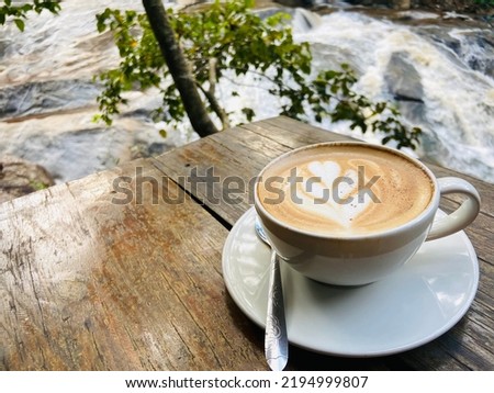 A cup of hot coffee on the wooden table with the light of sun, it’s the good first thing after wake up in the morning for starting a good day. Make feeling fresh and relax with a smell and taste good.
