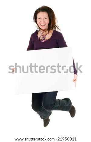 smiling woman holding blank billboard and jumping