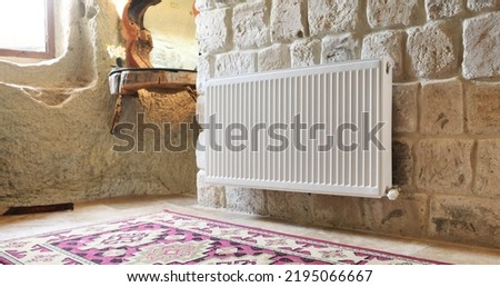 White radiator in an apartment. Radiator.