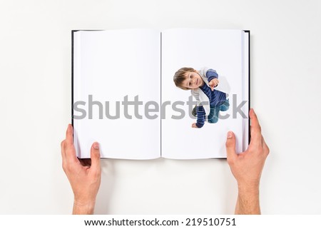 Boy pointing to the front printed on book