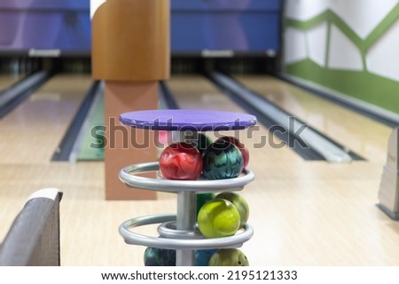 Bowling center.Bowling game.A place for recreation and entertainment.