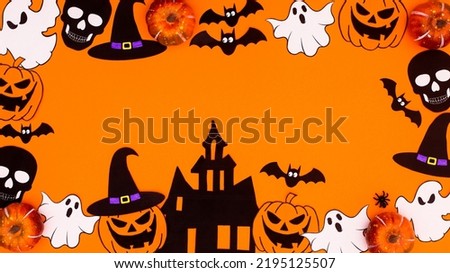 Creative Halloween frame made of various scary stickers on orange background. Copy space flat lay