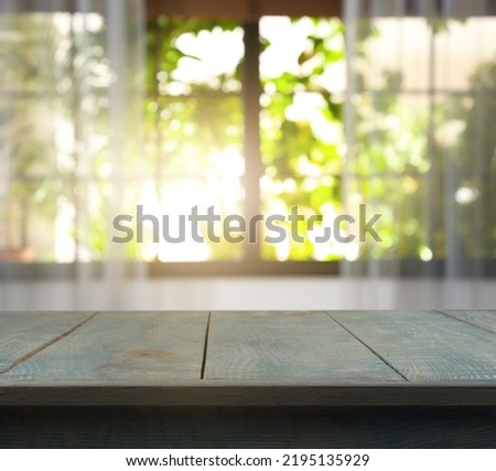 Empty light blue wooden surface in room. Mockup for design