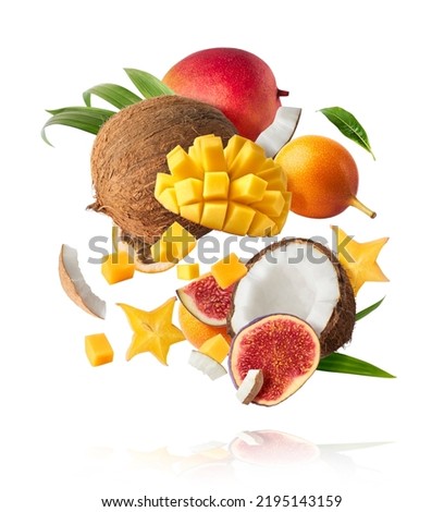 Exotic fruit mix, coconuts, mango, fig, passiflora, carambola falling in te air isolated on white background. Food levitation, zero gravity conception. High resolution image Royalty-Free Stock Photo #2195143159