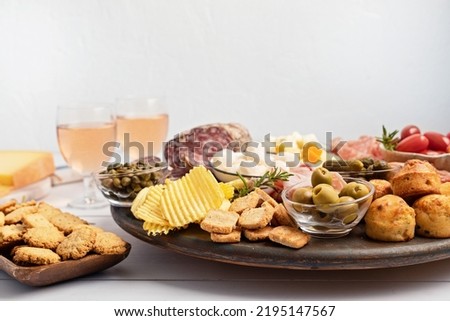 Appetizers table with different antipasti, charcuterie, snacks, cheese. Finger food for buffet party. Traditional french or italian entires. Top view Royalty-Free Stock Photo #2195147567