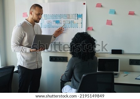 Busy office staff calmly discussing working moments