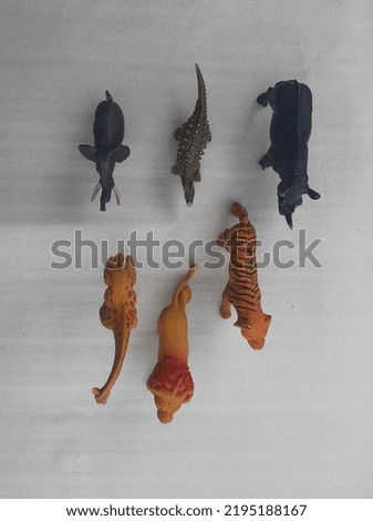 Wild animal toy on a white background. Save the animal concept. Top view.
