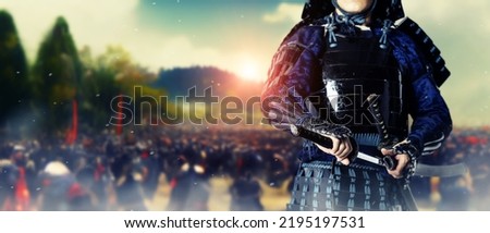 A samurai standing on the battlefield. Sengoku period. Wide image for banners, advertisements. Royalty-Free Stock Photo #2195197531
