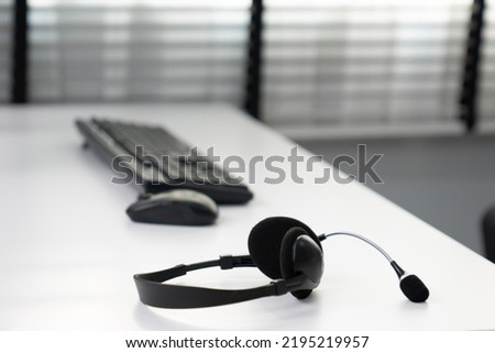 Close up image of headphones for competent online working. Customer service operator equipments.