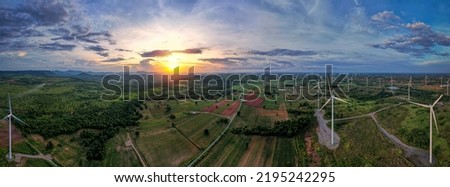 Aerial view of a nice windmill on a green, Agriculture fields and different variety of harvest, Panorama view of forest Aerial view of the sky, Panoramic beautiful landscape with sky and sunlight.