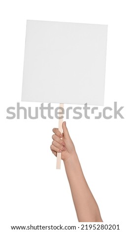 Woman holding blank protest sign on white background, closeup Royalty-Free Stock Photo #2195280201