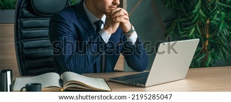 Businessman working with laptop in modern office. General manager,ceo. Young handsome confident man in suit sitting at table. Executive business leader. Entrepreneur career.Accountant bank workplace. Royalty-Free Stock Photo #2195285047