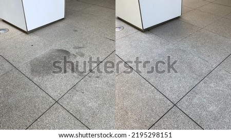 Before and after, stain removal and cleaning of oil stains on an outdoor gray granite floor Royalty-Free Stock Photo #2195298151