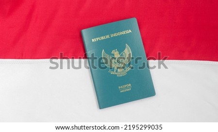 Indonesia passport on the Indonesian flag ,An Indonesian passport is a travel document issued by the Government of Indonesia