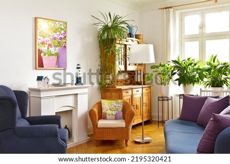 Custom-made home decoration concept: colorful living room with a framed print of flower picture and throw pillow of the same photo.