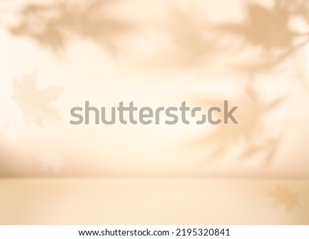 Autumn background with shadow of the maple tree leaves on a wall. Abstract Autumnal scene. Royalty-Free Stock Photo #2195320841
