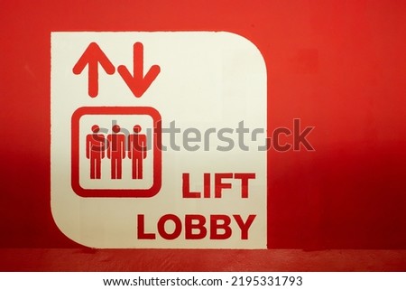 photo of a red lift lobby signage