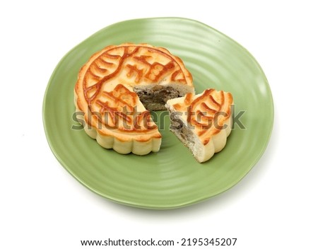 Mid-Autumn Festival moon cake on white background（Non-English texts translation :salt and pepper）