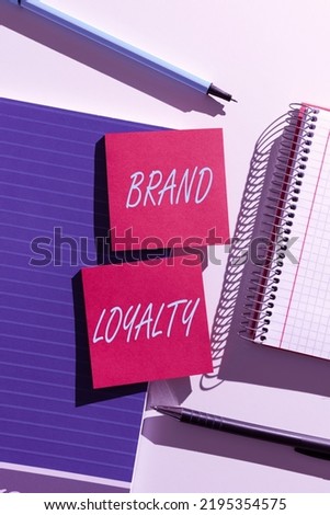 Inspiration showing sign Brand Loyalty. Business overview Repeat Purchase Ambassador Patronage Favorite Trusted Important News Presented On Two Sticky Notes On Desk With Notebook And Pens Royalty-Free Stock Photo #2195354575