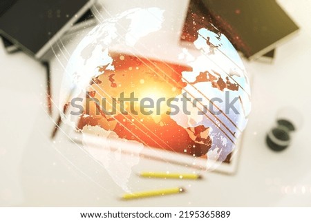 Multi exposure of abstract creative digital world map and digital tablet on background, top view, research and analytics concept