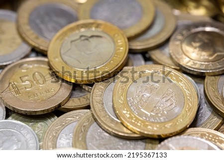 Turkish lira coins stacked in selective focus. 1 Turkish lira in selective focus. Business, finance, money, stock market, digital money concept. Royalty-Free Stock Photo #2195367133