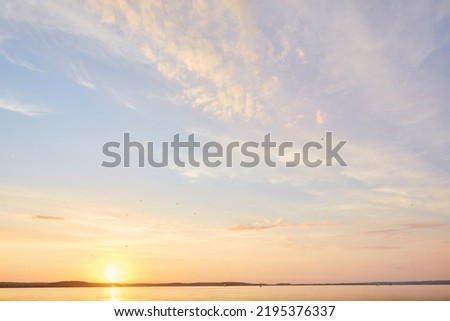 Beach dawn, sunrise. Evening sky with clouds. Golden hours. afternoon vanilla sky. Seashore sunburn or Sunset Royalty-Free Stock Photo #2195376337